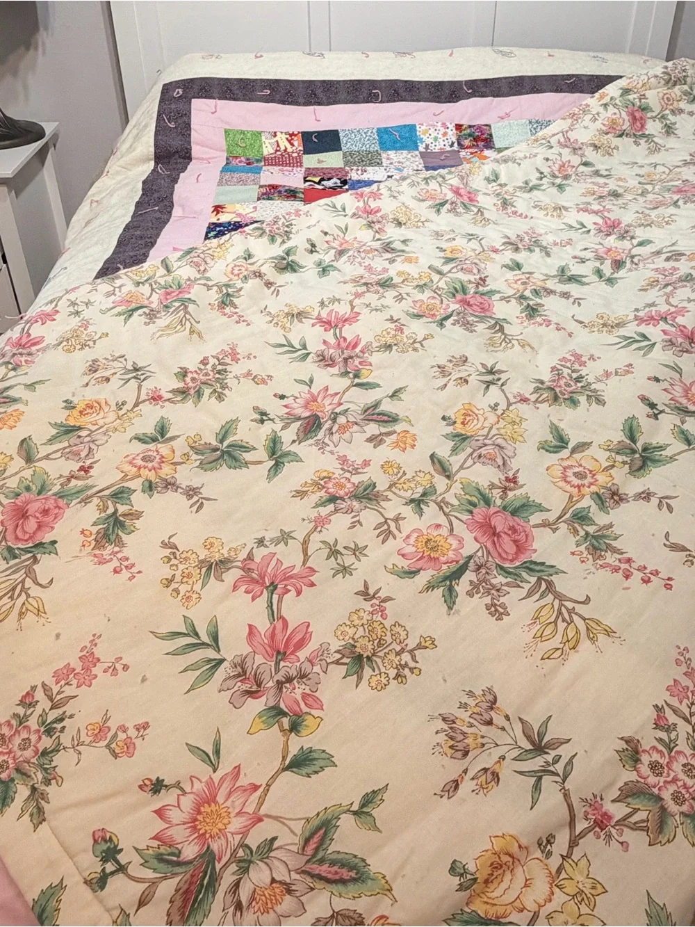 Hand crafted patchwork quilt with tan border